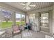 Inviting sunroom featuring brick details and multiple windows for ample natural light at 4038 Oak Trail Dr, Indianapolis, IN 46237