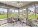 Cozy sunroom with brick accents and large windows offering scenic outdoor views at 4038 Oak Trail Dr, Indianapolis, IN 46237
