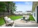 Inviting backyard patio with stylish furniture, perfect for outdoor relaxation and entertaining guests at 4619 Churchill Downs Cir, Greenwood, IN 46143