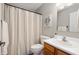 Well-lit bathroom featuring a wood vanity and shower with curtain at 4619 Churchill Downs Cir, Greenwood, IN 46143