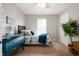 Comfortable bedroom with ceiling fan, a bright window, and a blue dresser at 4619 Churchill Downs Cir, Greenwood, IN 46143