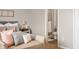 Bedroom featuring a decorative bed with a view of the bathroom through the doorway at 4619 Churchill Downs Cir, Greenwood, IN 46143