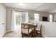 Cozy dining area with sliding glass doors, seating four and a view of the outdoors at 4619 Churchill Downs Cir, Greenwood, IN 46143