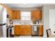 A well-appointed kitchen with stainless appliances and bright white countertops at 4619 Churchill Downs Cir, Greenwood, IN 46143