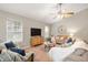Comfortable living room area featuring neutral paint, large comfy couches and a ceiling fan at 4619 Churchill Downs Cir, Greenwood, IN 46143