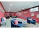Spacious basement area with comfortable seating, TV, and unique wall decorations for relaxation at 4754 Austin Trce, Zionsville, IN 46077