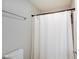 A clean bathroom displaying a white shower curtain, toilet, and simple fixtures at 4754 Austin Trce, Zionsville, IN 46077