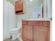 Bathroom features a toilet, vanity with sink, and a shower with a curtain at 4754 Austin Trce, Zionsville, IN 46077