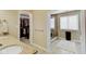 Bathroom featuring a walk-in closet, granite countertops, and a tile and glass shower at 4754 Austin Trce, Zionsville, IN 46077
