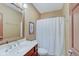 Bathroom featuring a vanity, mirror, and shower, all designed for maximum space savings at 4754 Austin Trce, Zionsville, IN 46077