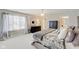 Bright primary bedroom featuring large window, dark wood dresser, and neutral decor at 4754 Austin Trce, Zionsville, IN 46077