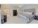 The primary bedroom with a gray color palette showcases modern furnishings and lighting at 4754 Austin Trce, Zionsville, IN 46077