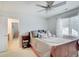 This bedroom features an ensuite bath and a ceiling fan for comfort at 4754 Austin Trce, Zionsville, IN 46077
