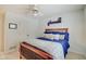 Bedroom features a wooden bed frame, ceiling fan, double closets for ample storage at 4754 Austin Trce, Zionsville, IN 46077