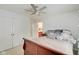 Bedroom featuring double closets, en suite bath, and a ceiling fan at 4754 Austin Trce, Zionsville, IN 46077