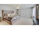 Large bedroom offers a tufted headboard, closet, and comfortable decor at 4754 Austin Trce, Zionsville, IN 46077