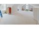Expansive bonus room featuring built-in shelving and a sun-filled arched window at 4754 Austin Trce, Zionsville, IN 46077