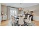 Traditional dining room featuring hardwood floors, and a stylish table with seating for six at 4754 Austin Trce, Zionsville, IN 46077