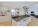 Bright kitchen with an island, granite countertops, stainless steel appliances, and ample cabinets at 4754 Austin Trce, Zionsville, IN 46077