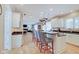 Open-concept kitchen with an eat-in island, stainless steel appliances, and hardwood floors at 4754 Austin Trce, Zionsville, IN 46077