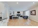 Spacious living room with hardwood floors, fireplace, custom bookshelves, and modern decor at 4754 Austin Trce, Zionsville, IN 46077