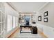 A well-lit home office showcasing built-in shelving and storage, with a refined desk setup at 4754 Austin Trce, Zionsville, IN 46077