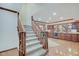 Beautiful staircase leading to a lower level with a bar, perfect for entertaining at 4754 Austin Trce, Zionsville, IN 46077
