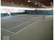 Indoor tennis court featuring professionally painted lines and netting for an active lifestyle at 4754 Austin Trce, Zionsville, IN 46077