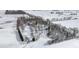 An aerial view of a country home surrounded by snow-covered fields and sparse trees in a winter landscape at 4859 W 150 N, Greenfield, IN 46140