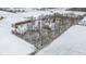 Aerial view showcasing the property and the snowy landscape showing the property lines at 4859 W 150 N, Greenfield, IN 46140