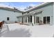 A sunroom, sliding doors, and a deck add a touch of elegance to the home's beautiful snow covered backyard at 4859 W 150 N, Greenfield, IN 46140