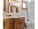 Cozy bathroom features a single sink vanity and a tub/shower combination for all bathing needs at 4859 W 150 N, Greenfield, IN 46140