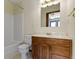 Bathroom featuring a shower-tub combo, a single sink vanity, and a toilet at 4859 W 150 N, Greenfield, IN 46140