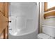 Updated bathroom includes a white tub/shower combination and toilet at 4859 W 150 N, Greenfield, IN 46140