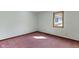 Bright bedroom with a wooden window frame showcasing natural light on plush pink carpet at 4859 W 150 N, Greenfield, IN 46140