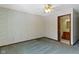 Bedroom featuring paneled windows, patterned wallpaper, carpet, and a doorway to a bathroom at 4859 W 150 N, Greenfield, IN 46140