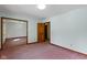 Spacious bedroom featuring soft light with mirrored closet doors and plush pink carpeting at 4859 W 150 N, Greenfield, IN 46140