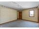 Slanted bedroom ceiling with patterned wallpaper, broadloom carpeting and natural light at 4859 W 150 N, Greenfield, IN 46140