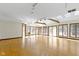 Bright living room featuring wood floors, skylights, and large windows providing plenty of natural light at 4859 W 150 N, Greenfield, IN 46140