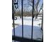 Winter backyard view with a covered picnic table seen through decorative metal bars at 5139 S Keystone Ave, Indianapolis, IN 46227