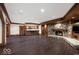 Finished basement has stone fireplace, bar area with custom cabinetry, and recessed lighting at 5400 W Deer Run Ct, Muncie, IN 47304