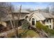 Charming exterior view of the home with stone accents and mature landscaping at 5400 W Deer Run Ct, Muncie, IN 47304