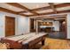 Inviting game room with hardwood floors and pool table, perfect for entertainment at 5400 W Deer Run Ct, Muncie, IN 47304