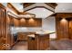 Basement kitchen with custom cabinetry, a breakfast bar, and recessed lighting at 5400 W Deer Run Ct, Muncie, IN 47304