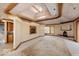 Bright living room with beamed ceilings, fireplace, and custom details at 5400 W Deer Run Ct, Muncie, IN 47304
