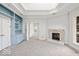 Living room with built-in shelves, fireplace, and large windows offering natural light and views at 5400 W Deer Run Ct, Muncie, IN 47304