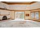 Elegant living room with fireplace, large windows, and custom ceiling at 5400 W Deer Run Ct, Muncie, IN 47304