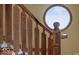 Unique staircase with decorative wood carvings and a distinctive round window at 5400 W Deer Run Ct, Muncie, IN 47304