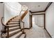 Staircase featuring wood stairs, clear railings, and a view of the hallway leading to the other rooms at 5400 W Deer Run Ct, Muncie, IN 47304