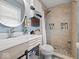 Updated bathroom with a tiled shower, modern vanity, and stylish fixtures, providing a clean and contemporary space at 5415 Honey Comb Ln, Indianapolis, IN 46221